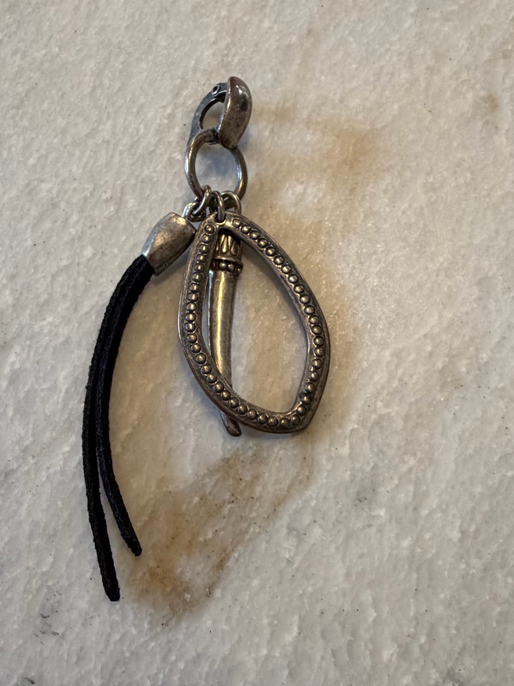 Silver-Tone Oval Pendant Necklace with Black Tassel